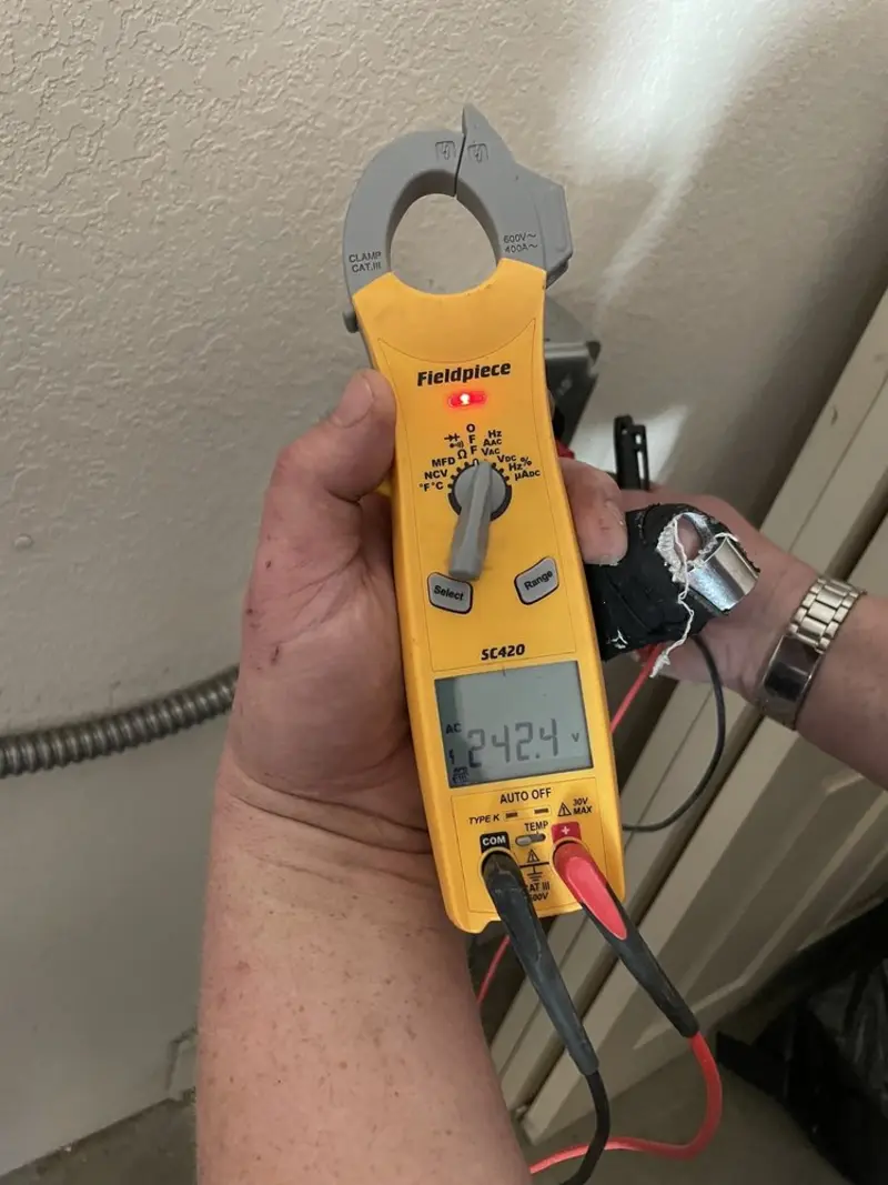 Voltage testing with clamp meter during Ceiling Fan Installation in Rapho